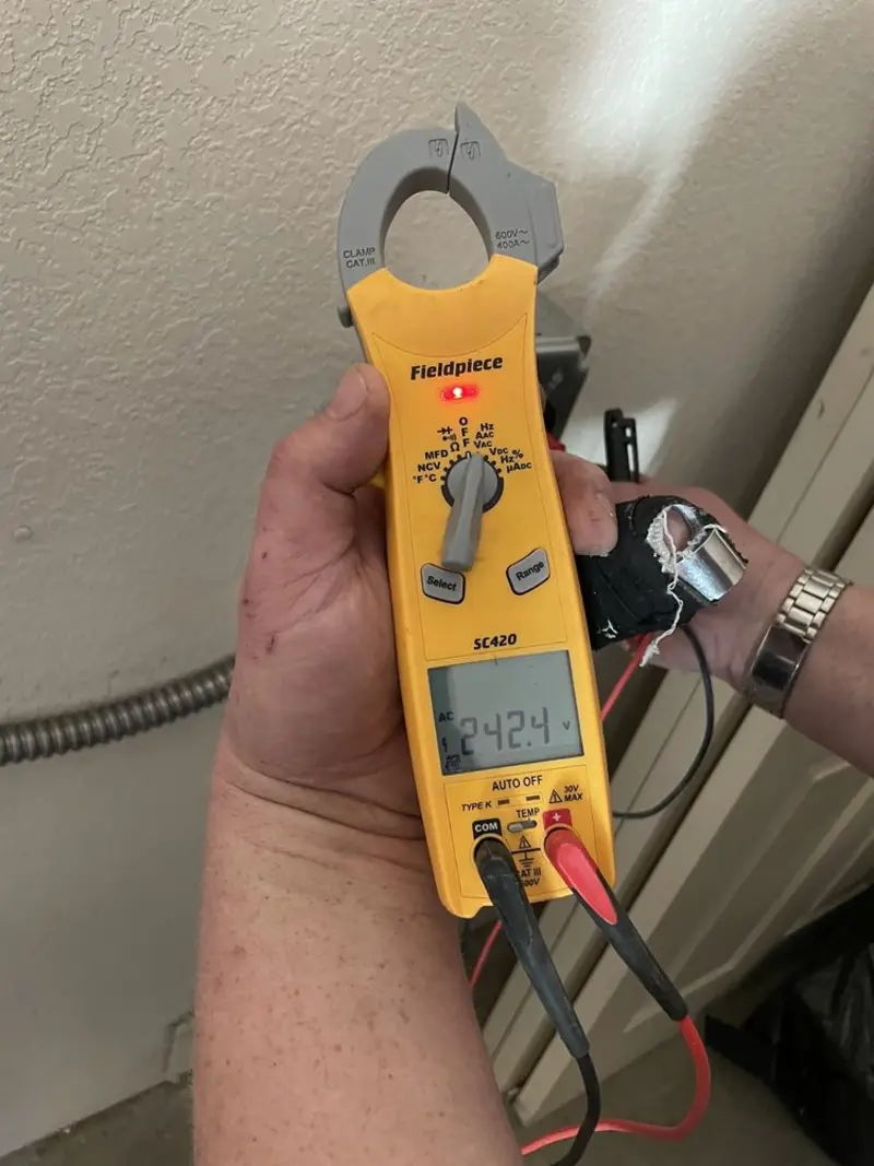 Voltage testing with clamp meter during Circuit Breaker Repair in Boxborough